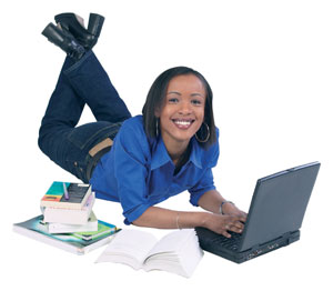 Student using laptop on floor